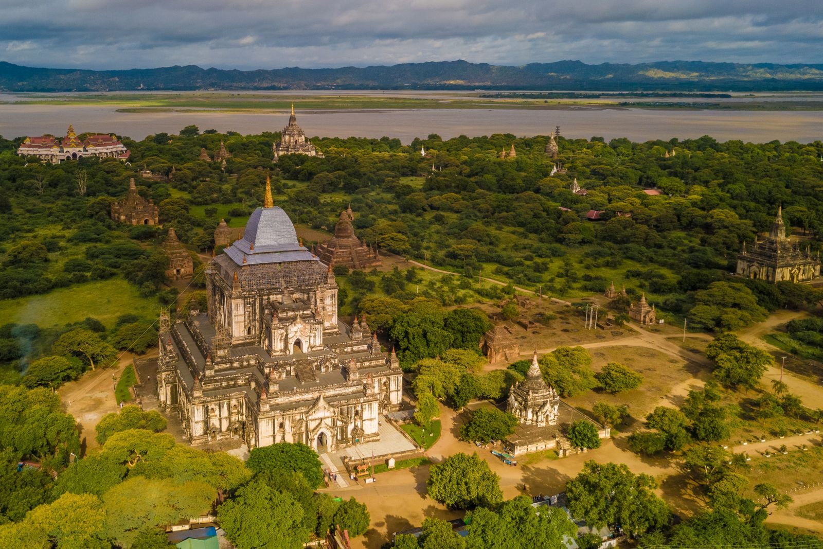Aerial view of Thatbyinnyu Temple in Bagan with the Irrawaddy River beyond, the far end of an Irrawaddy river cruise from Mandalay to Bagan
